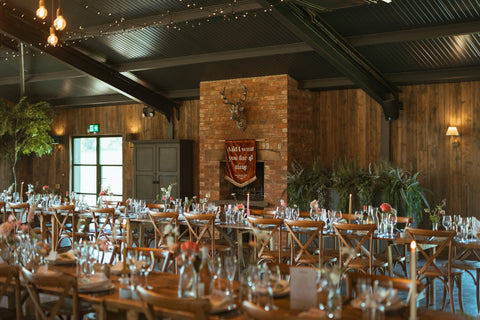 Venue shot of velvet wedding banner with "and i want you for all time" text