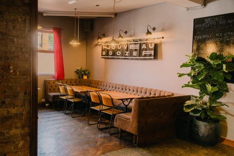 Horizontal banner in The Beagle Pub, Manchester with "Nouveau Boozer" text in white