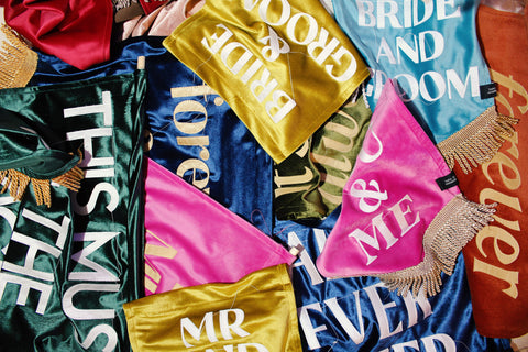 Multiple velvet banners in an array of colours showing different styles