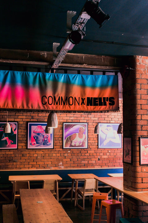 Interior horizontal banner with "Common X Nell's" text in bar