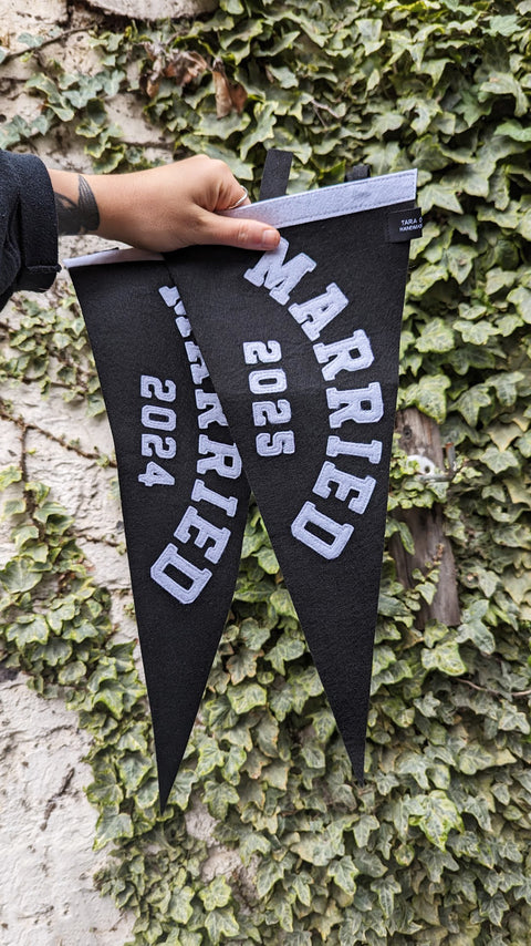 Pennant banners in black and white with "married" and the year text on ivy leaf background.