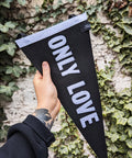 Pennant banner in black and white with "only love" text on.